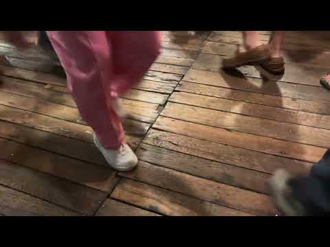 Dancers on the Mercantile's wooden floor.