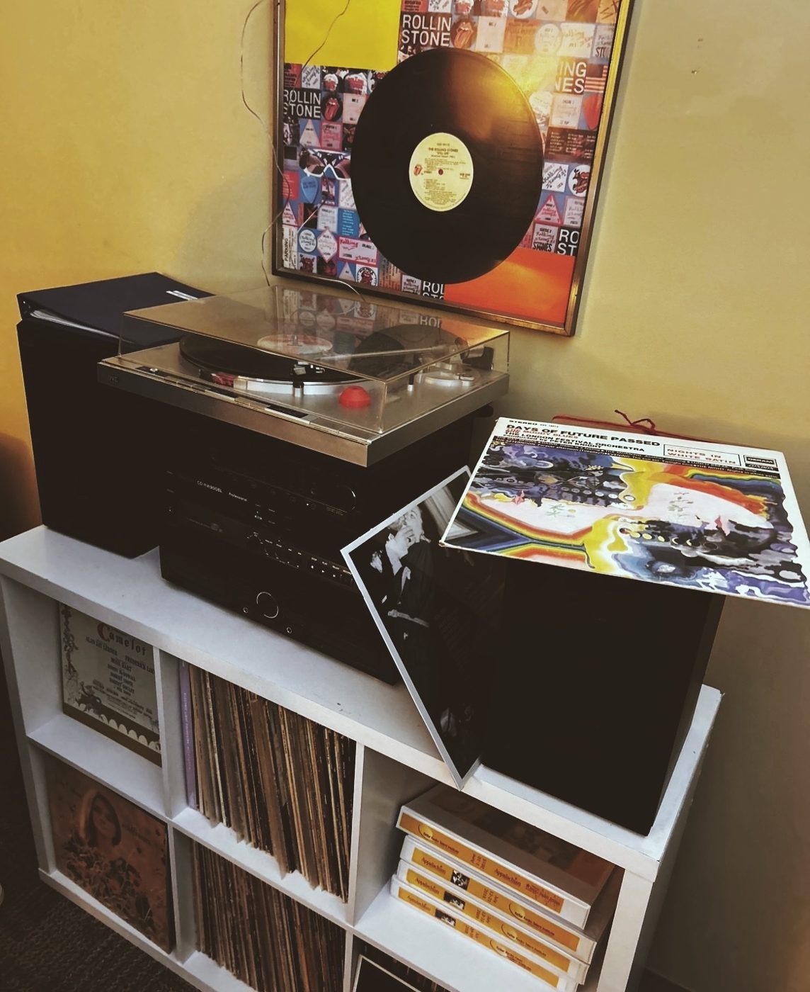 A turntable and a shelf of records at the station. There's room for yours.